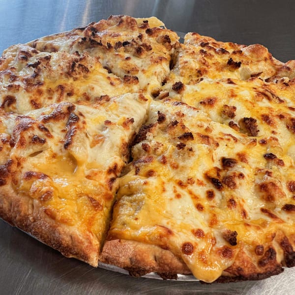 A freshly baked B Antonio's Pizza with melted cheese and crispy crust, sliced and ready to eat.